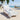 'Rocket Bike Spec Sheet' beach towel, large size, on a beach chair